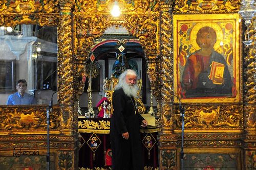 PRIEST INSIDE A MYKONOS MONASTERY 2-2-2010 7-53-14 πμ 500x332